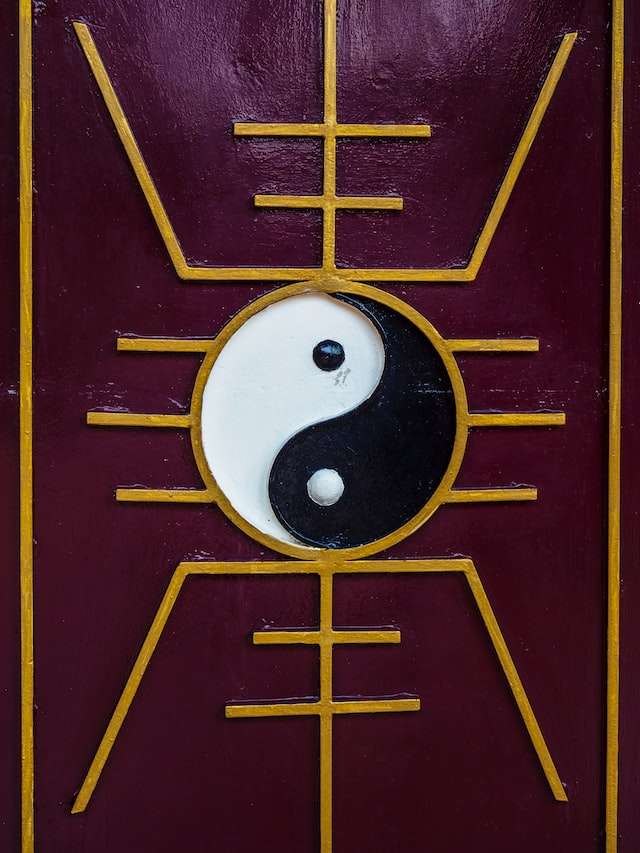 feng shui logo on a purple board