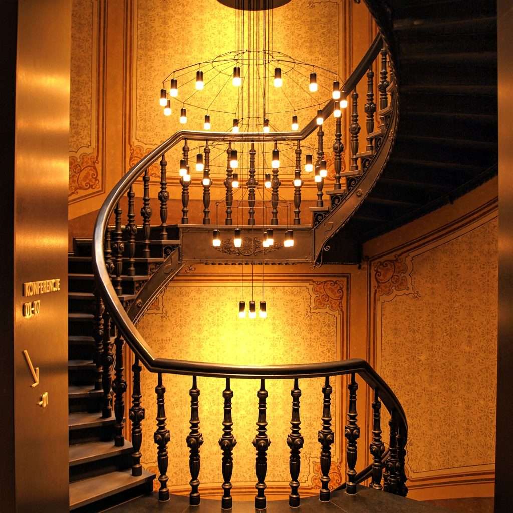 Brown Wooden Stairs and Chandelier